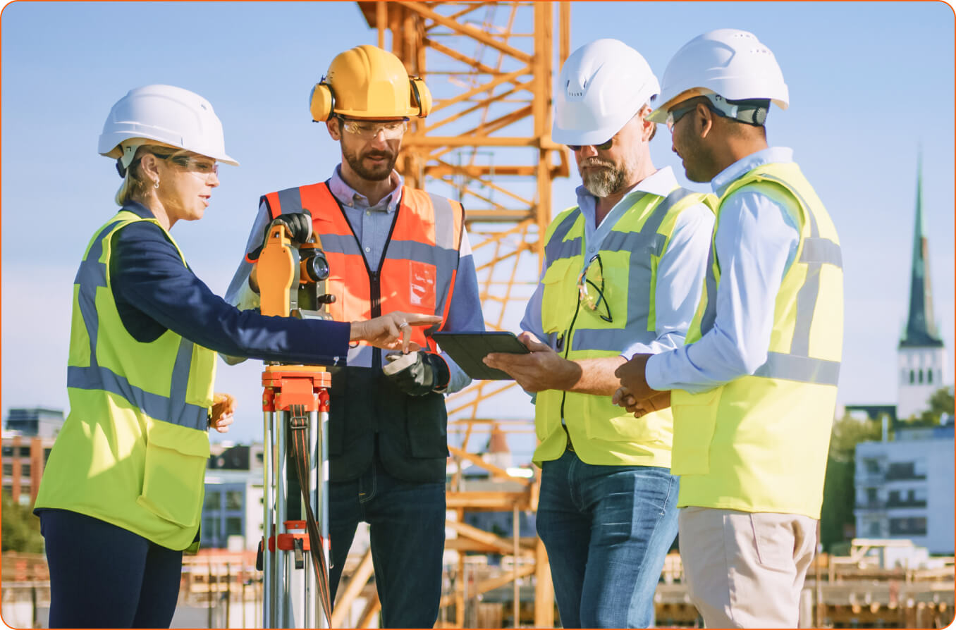 Construction workers talking on site